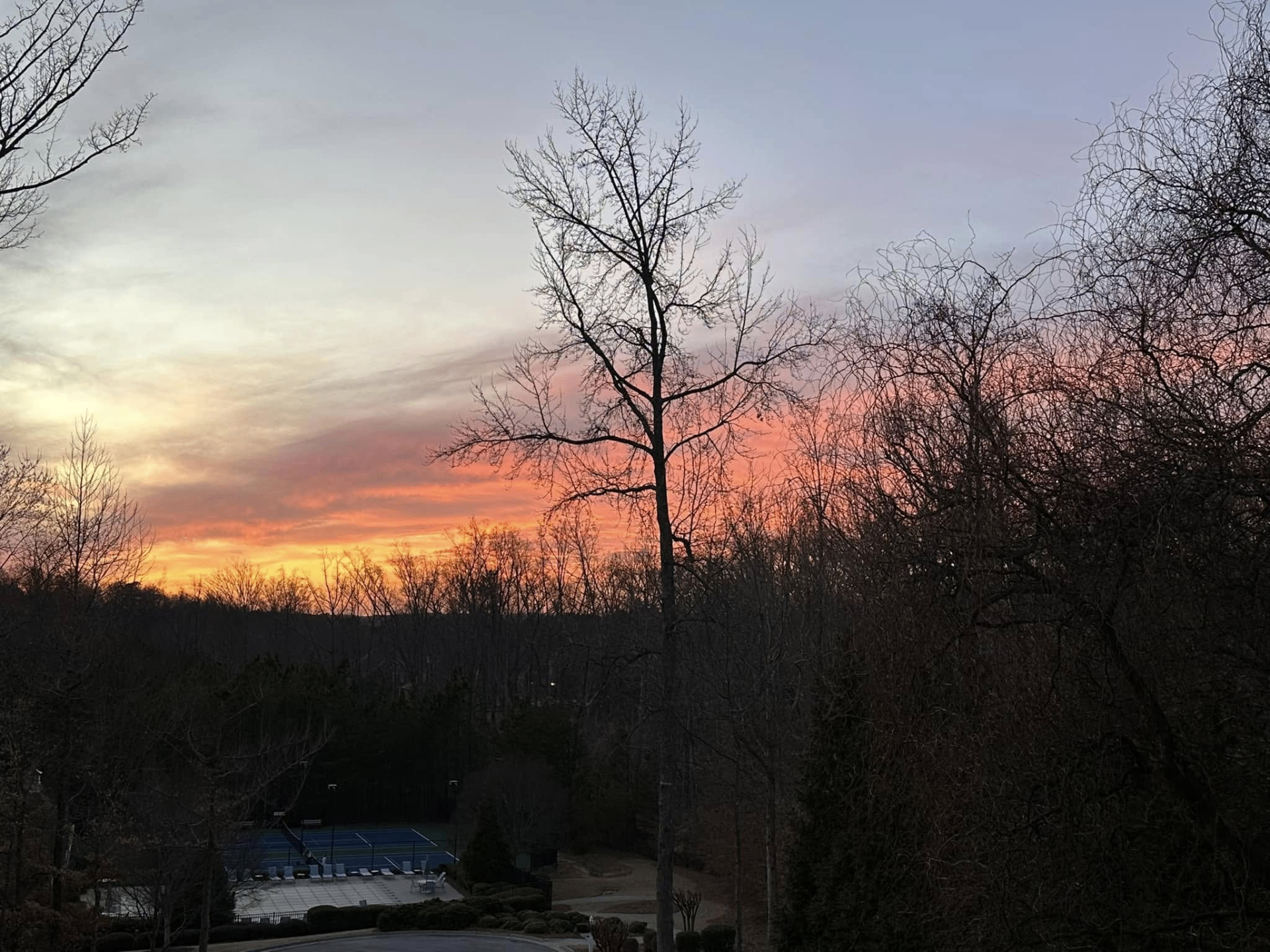 Sunset over the tennis courts at The Hampshires